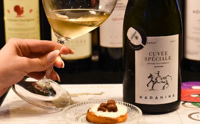 Greek wine tasting in Athens with white wine, Greek wine bottle and local food pairing