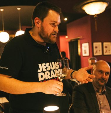Sommelier guiding guests during a Greek wine tasting experience in Athens