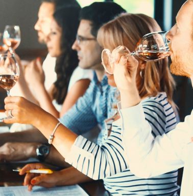 Guests tasting wine during a guided wine tasting experience in Athens